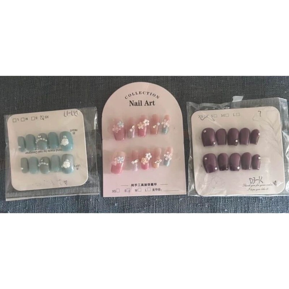Three sets of artificial nails.